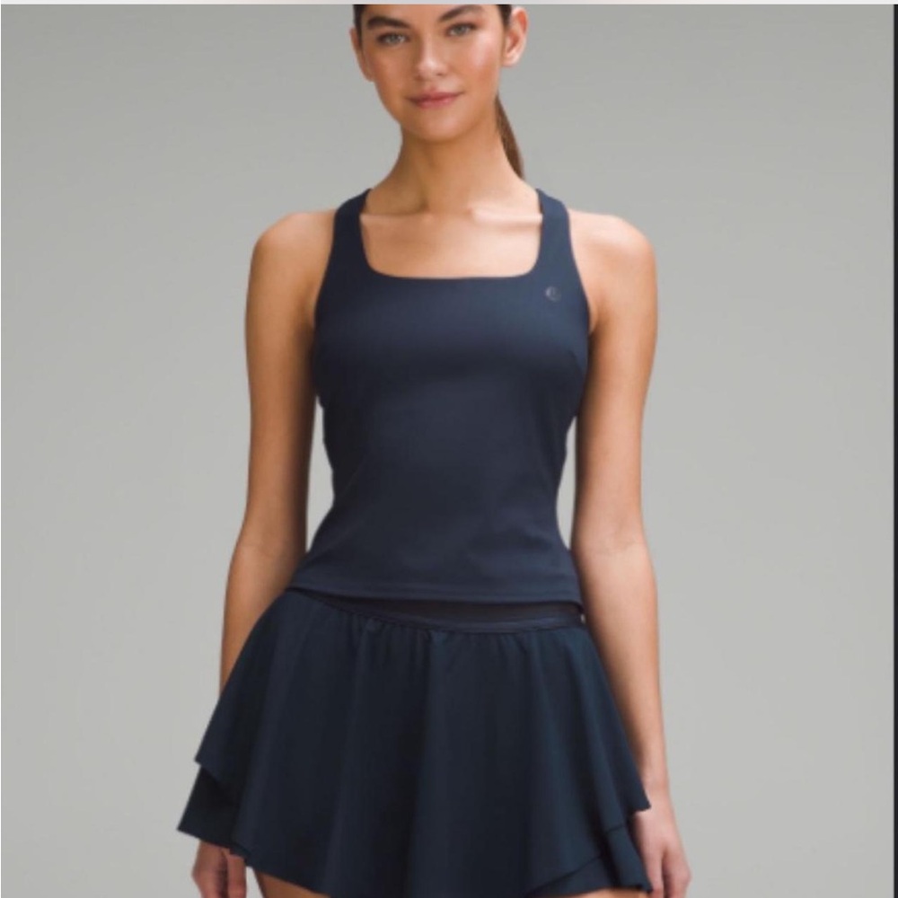 Lululemon tennis top. Navy blue. Still has tags. Never worn. Perfect condition